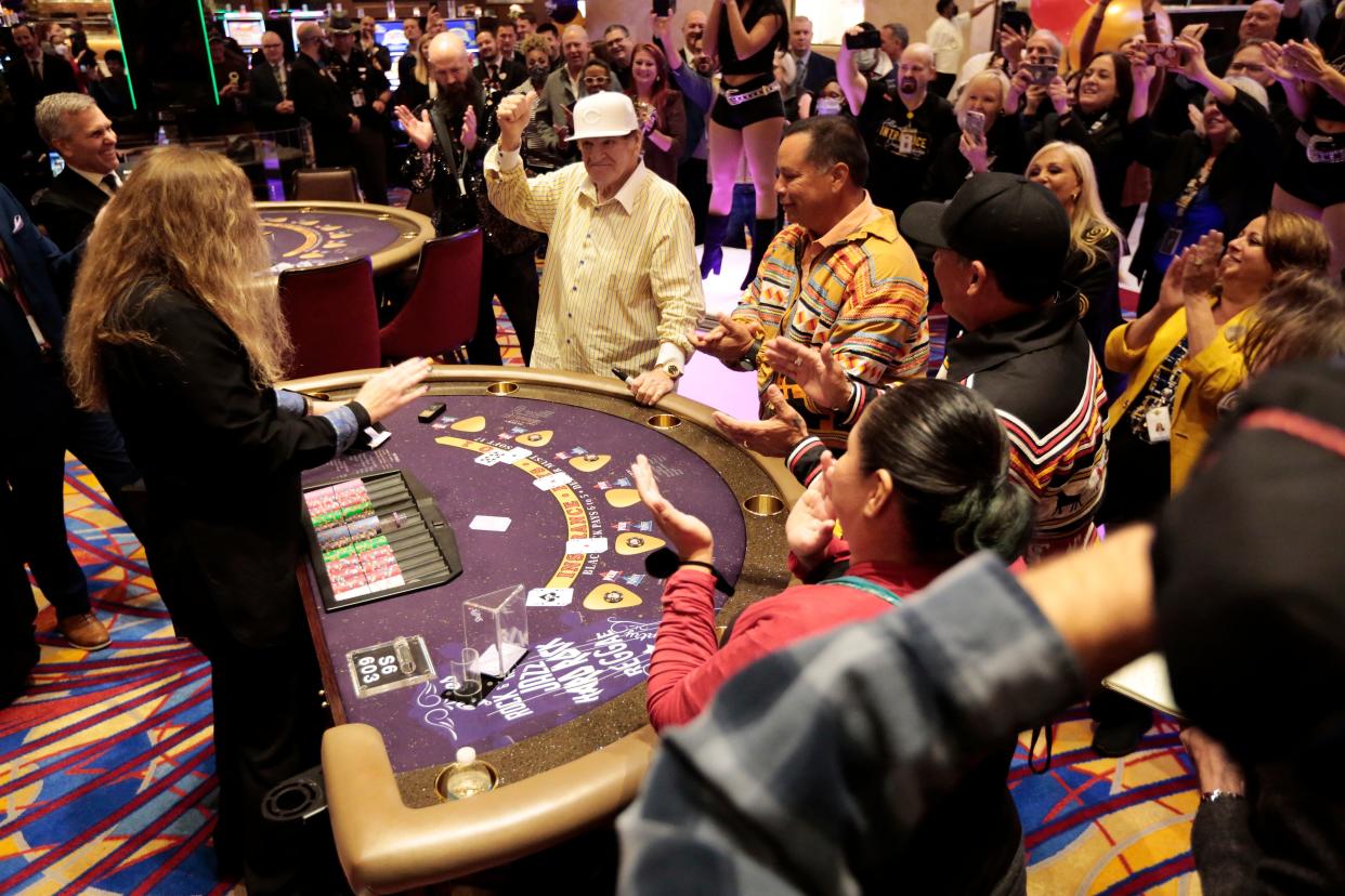 Pete Rose gives a thumbs up as he places the inaugural bet on a hand of blackjack during the grand opening of the newly rebranded Hard Rock Casino in downtown Cincinnati on Oct. 29, 2021. The former Reds player and baseball's all-time hits leader will return to the casino Jan. 1 to place the first bet when sports gambling becomes legal in Ohio.