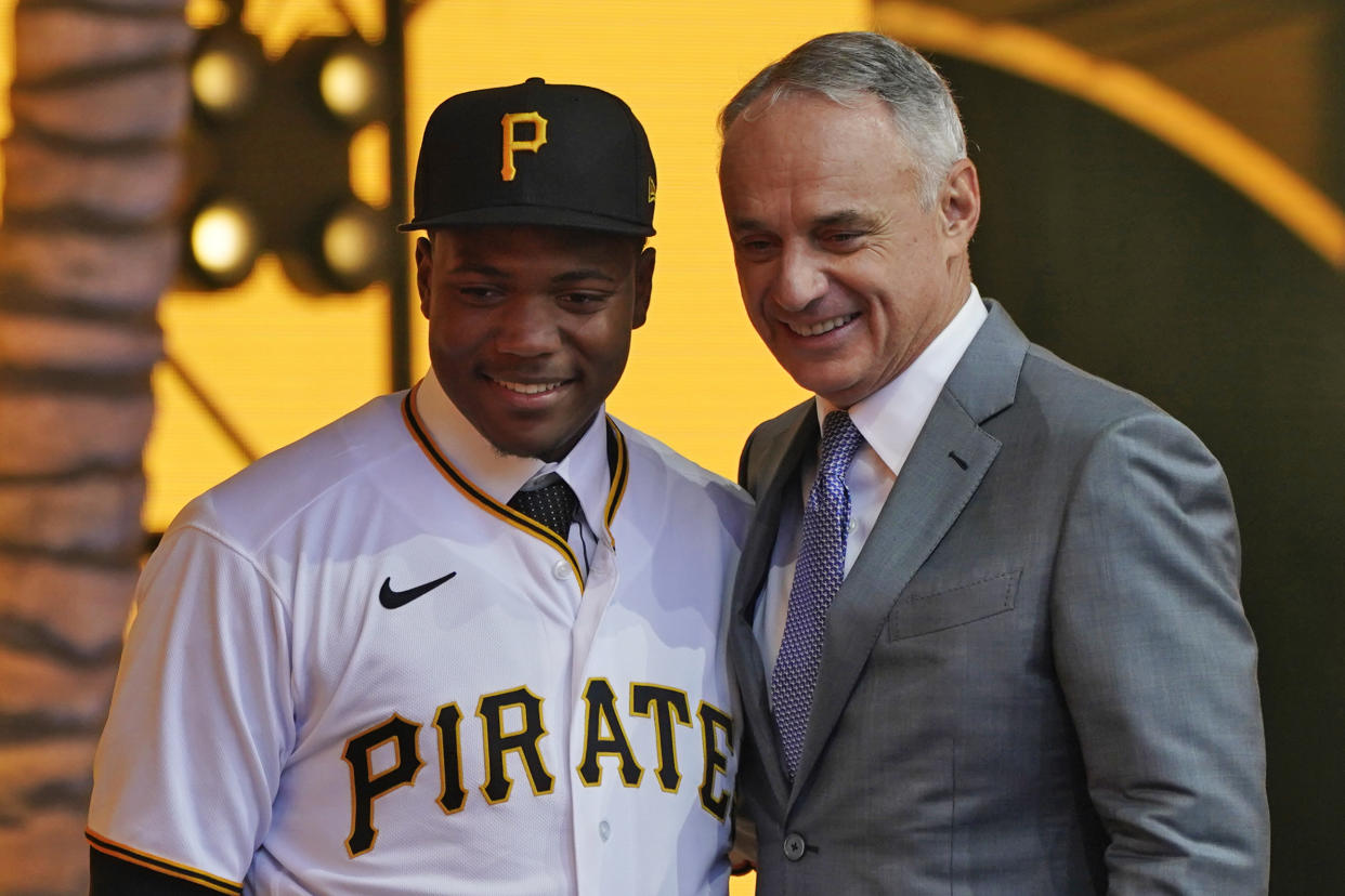 Termarr Johnson, left, poses with MLB Commissioner Rob Manfred after Johnson was selected by the Pittsburgh Pirates with the fourth pick of the 2022 MLB baseball draft, Sunday, July 17, 2022, in Los Angeles. (AP Photo/Abbie Parr)