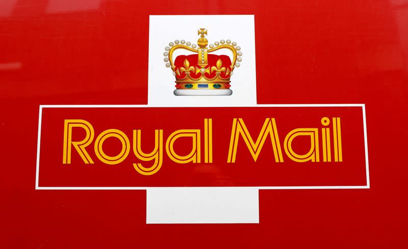 A Royal Mail sign is pictured on a delivery van outside a Post Office, in St Albans