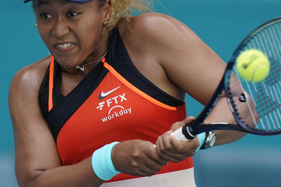 File - The FTX logo appears on Naomi Osaka's outfit during the Miami Open tennis tournament, April 2, 2022, in Miami Gardens, Fla. A host of Hollywood and sports celebrities including Larry David and Tom Brady were named as defendants in a class-action lawsuit against cryptocurrency exchange FTX, arguing that their celebrity status made them culpable for promoting the firm's failed business model. (AP Photo/Wilfredo Lee, File)