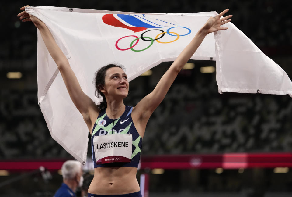 Mariya Lasitskene, of Russian Olympic Committee, reacts after winning the women's high jump final at the 2020 Summer Olympics, Saturday, Aug. 7, 2021, in Tokyo.(AP Photo/Charlie Riedel)