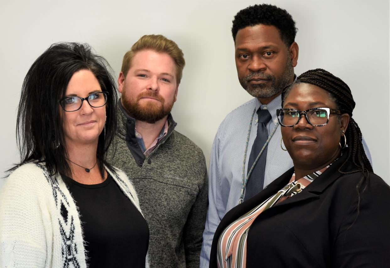 Hamilton County probation officers Jodi Stanton, Aaron King, James Mack and Aisha Howard (from left) call the juveniles offenders they work their "their kids." They have all lost kids to gun violence and they frequently the juveniles charged with murder are under their care.