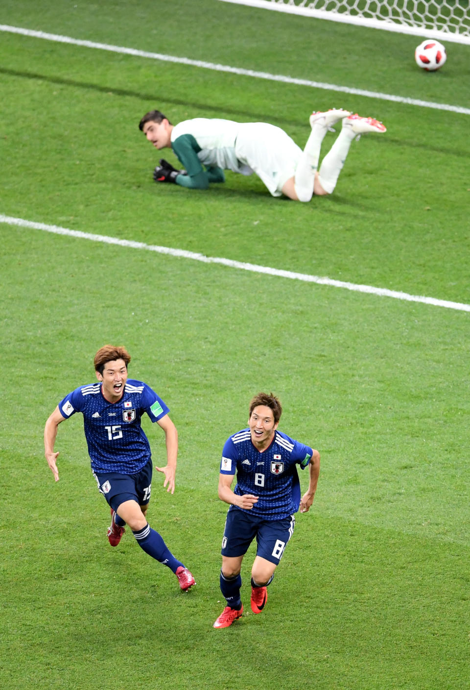 <p>Genki Haraguchi of Japan celebrates with team mate Yuya Osako after scoring his team’s first goal during the 2018 FIFA World Cup Russia Round of 16 match between Belgium and Japan at Rostov Arena on July 2, 2018 in Rostov-on-Don, Russia. (Photo by Laurence Griffiths/Getty Images) </p>