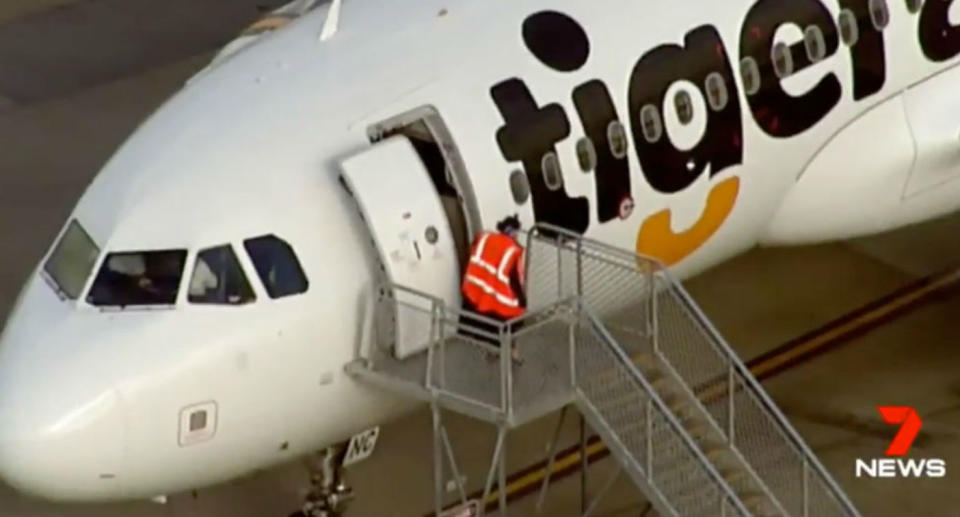 Three people were affected after reports of fumes on a Tigerair flight. Source: 7 News