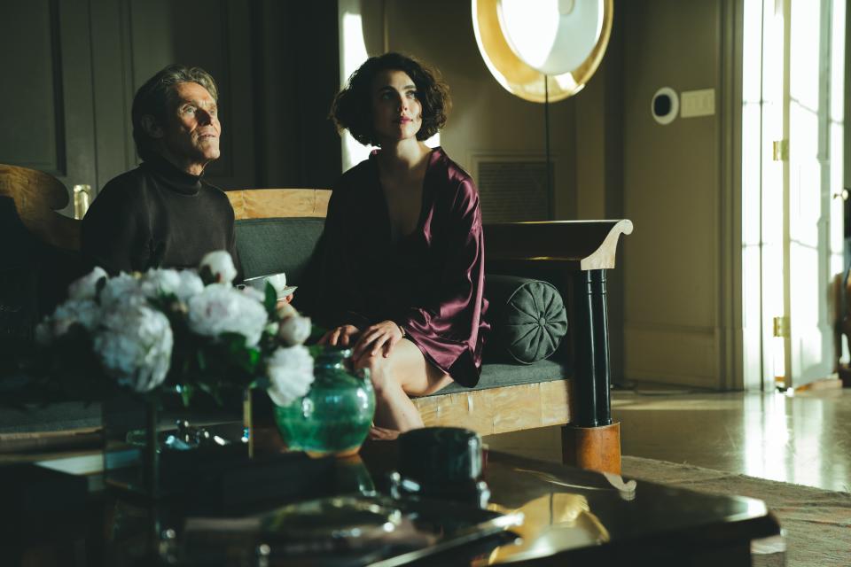 Willem Dafoe and Margaret Qualley perch on the Biedermeier sofa in the first part of the film.