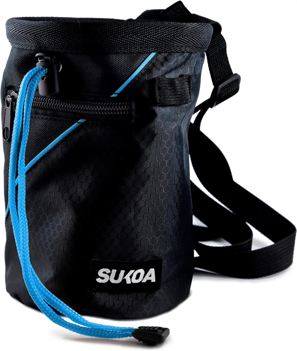 black chalk bag with blue closure