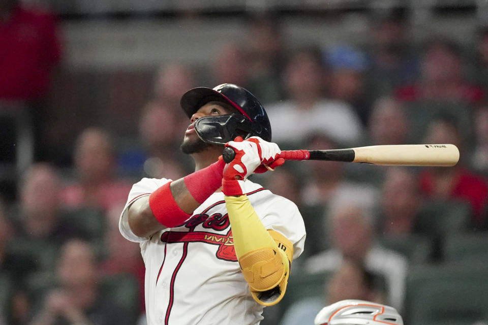 Atlanta Braves' Ronald Acuna Jr. watches his RBI double during the second inning of the team's baseball game against the New York Mets on Monday, Aug. 15, 2022, in Atlanta. (AP Photo/John Bazemore)