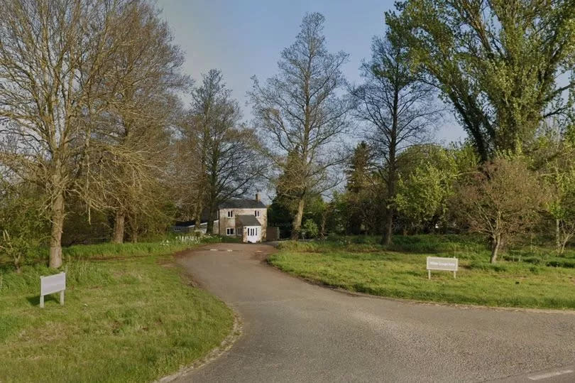 Entrance to Willow Grange Farm with road leading up to farm house.