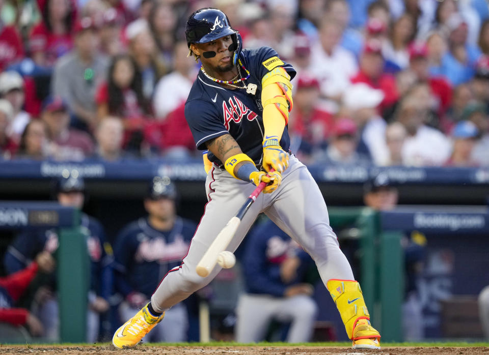 FILE - Atlanta Braves' Ronald Acuna Jr. hits a double during the third inning of Game 3 of a baseball NL Division Series against the Philadelphia Phillies, Oct. 11, 2023, in Philadelphia. This season, the Braves and stars like Acuna will try to finish the job after a disappointing early exit in last year's playoffs. (AP Photo/Matt Slocum, File)