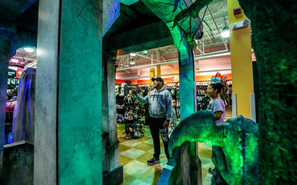 Families shop at Spirit Halloween, one of several Halloween outlets on Bald Hill Road