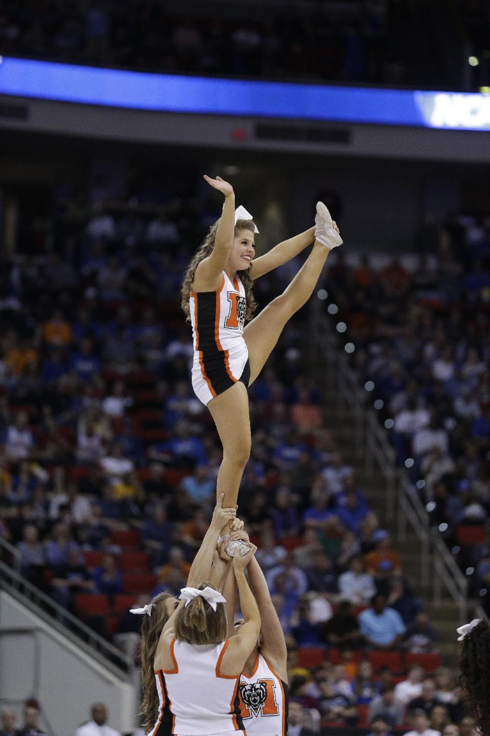 Mercer cheerleaders perform during the first half of an NCAA college basketball second-round game against Duke, Friday, March 21, 2014, in Raleigh, N.C. (AP Photo/Chuck Burton)
