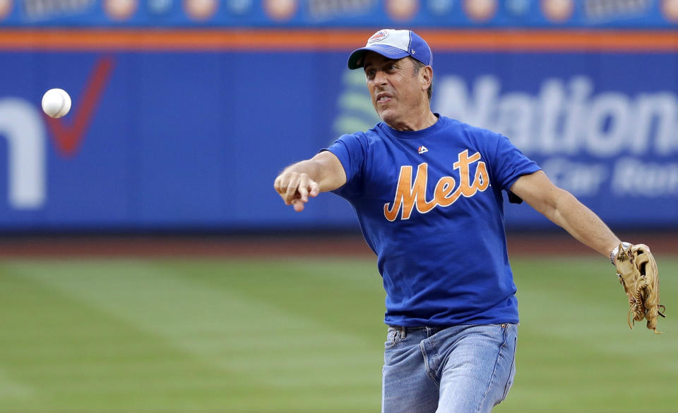 FILE - Comedian Jerry Seinfeld throws out a ceremonial first pitch before the New York Mets baseball game against the Philadelphia Phillies on July 5, 2019, in New York. Seinfeld turns 67 on April 29. (AP Photo/Frank Franklin II, File)