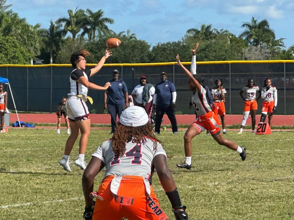 Pembroke Pines Charter quarterback Ava Rivera throws a pass over a rushing Homestead defender during the Jaguars’ 26-6 win over the Broncos on Friday afternoon at Homestead High.