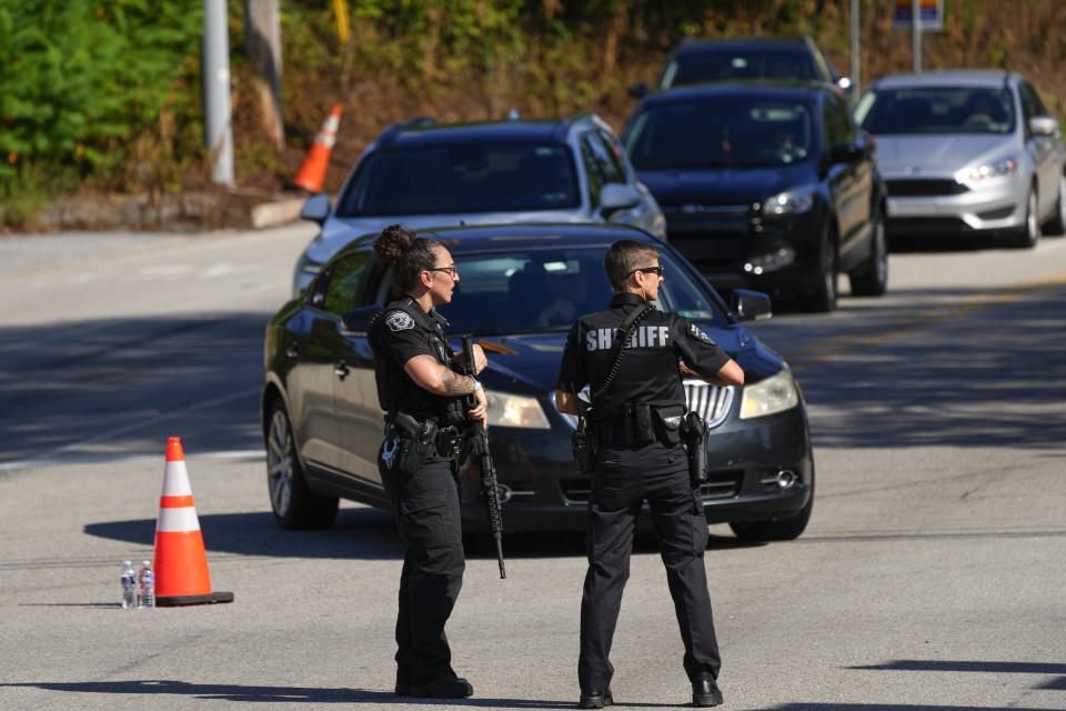 Law enforcement officers stand guard as the search for escaped convict Danelo Cavalcante continues in Pottstown, Pa., Tuesday, Sept. 12, 2023. (AP Photo/Matt Rourke)