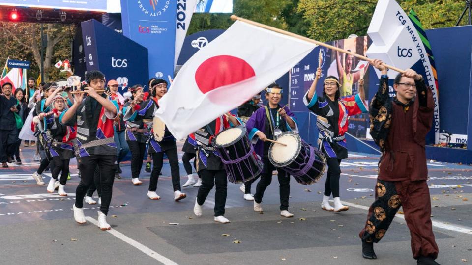 <div>NEW YORK, UNITED STATES - 2022/11/04: Japan delegation walks during parade of nations held at the opening ceremony for 2022 TCS New York City Marathon in Central park. (Photo by Lev Radin/Pacific Press/LightRocket via Getty Images)</div>