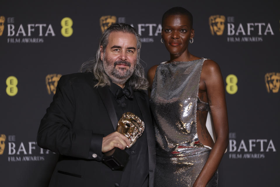 Hoyte van Hoytema, left, winner of the cinematography award for 'Oppenheimer' and Sheila Atim pose for photographers at the 77th British Academy Film Awards, BAFTA's, in London, Sunday, Feb. 18, 2024. (Photo by Vianney Le Caer/Invision/AP)