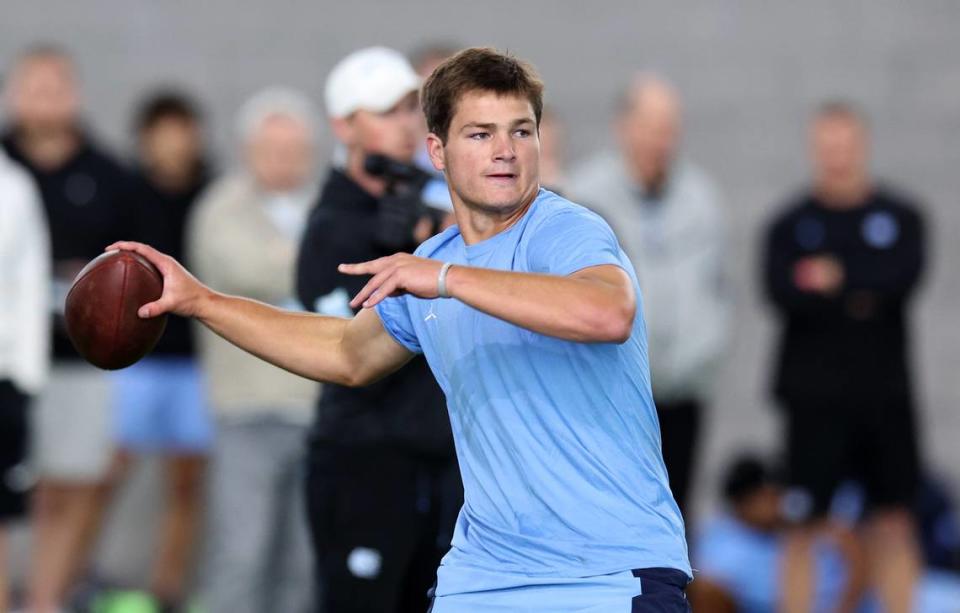 Drake Maye drops back to pass to a receiver during the Carolina Football Pro Day at UNC Chapel Hill’s Koman Indoor Practice Facility on Thursday, March 28, 2024.