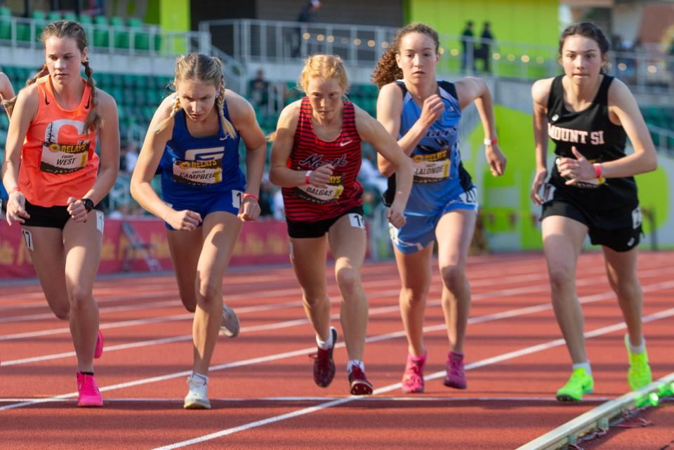 North Salem's Nelida Dalgas, center, starts with the pack in the girls 2 mile at the Oregon Relays at Hayward Field Friday, April 19, 2024.