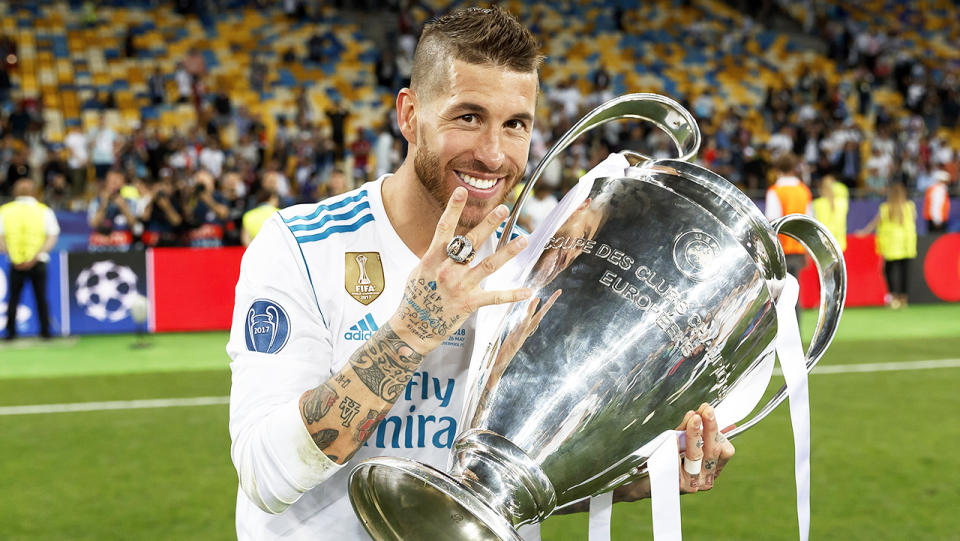 Sergio Ramos (pictured) holding the Champions League trophy.