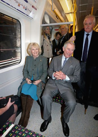 CHRIS JACKSON/POOL/AFP via Getty Images Camilla and Charles ride the tube in London in 2013