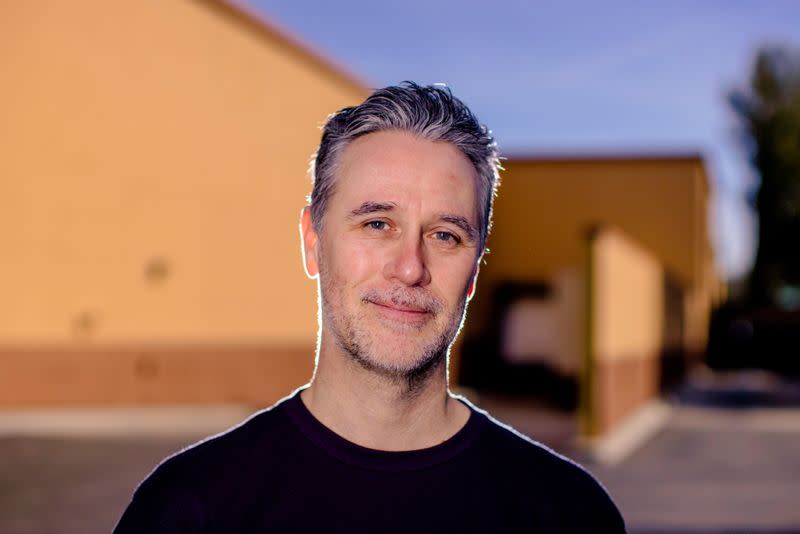 CEO at USA Skateboaring Friedberg poses for a portrait while skateboard in California