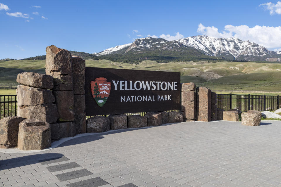 This photo provided by the National Park Service shows a sign marking the north entrance of Yellowstone National Park on May 7, 2018. Samson Lucas Bariah Fussner is accused of firing a semiautomatic rifle at the entrance of a Yellowstone National Park dining facility with some 200 people inside on Thursday, July 4, 2024. (Jacob W. Frank/National Park Service via AP)