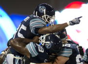 Toronto Argonauts wide receiver Sammie Parker (85) is hoisted aloft by teammates Stephen Good (62) and Darion Smith (69) after scoring the game winning touchdown in fourth quarter CFL pre-season action against the Montreal Alouettes in Toronto on Tuesday June 19, 2012. THE CANADIAN PRESS/FRANK GUNN