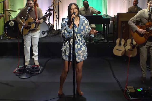 <p>Saturday Night Life/ YouTube</p> Kacey Musgraves wears a quilted Ralph Lauren coat as she performs barefoot on 'Saturday Night Live' on March 2, 2024.