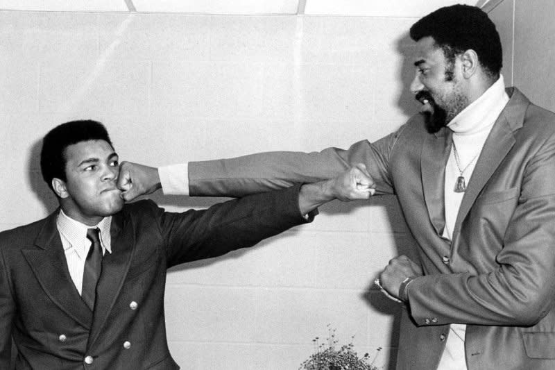 Basketball star Wilt Chamberlain (R) throws a fake punch at former champion Muhammad Ali (L) on April 2, 1971. On March 2, 1962, Philadelphia's Chamberlain set the single-game NBA scoring record with 100 points against the New York Knicks. UPI File Photo