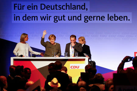 German Chancellor Angela Merkel, a top candidate of the Christian Democratic Union Party (CDU) for the upcoming general elections, waves to supporters during an election rally in Hamburg, Germany, September 20, 2017. REUTERS/Morris Mac Matzen