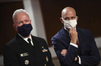 Adm. Brett Giroir, left, director of the U.S. coronavirus diagnostic testing, and Food and Drug Administration (FDA) Commissioner Stephen Hahn, prepare to testify before a Senate Health, Education, Labor and Pensions Committee hearing on Capitol Hill in Washington, Tuesday, June 30, 2020. (Kevin Dietsch/Pool via AP)