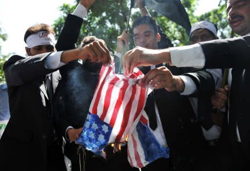 Pakistani lawyers burn a US flag as they attempt to reach the US embassy in the diplomatic enclave during a protest against an anti-Islam movie in Islamabad on September 19. A US judge refused Thursday to order the video sharing website YouTube to take down a trailer for an anti-Islamic film that has triggered protests across the Muslim world