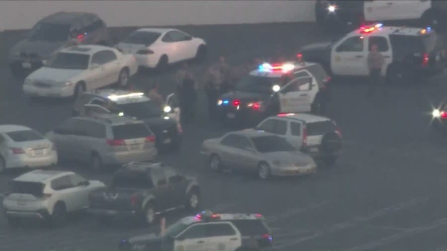 A spike stripe was successfully deployed on the vehicle as the driver continued moving around the parking lot. (KTLA)