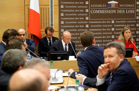 French Interior Minister Gerard Collomb (C) arrives to be questioned by lawmakers at the National Assembly about presidential aide Alexandre Benalla (not pictured) in Paris, France, July 23, 2018. REUTERS/Philippe Wojazer