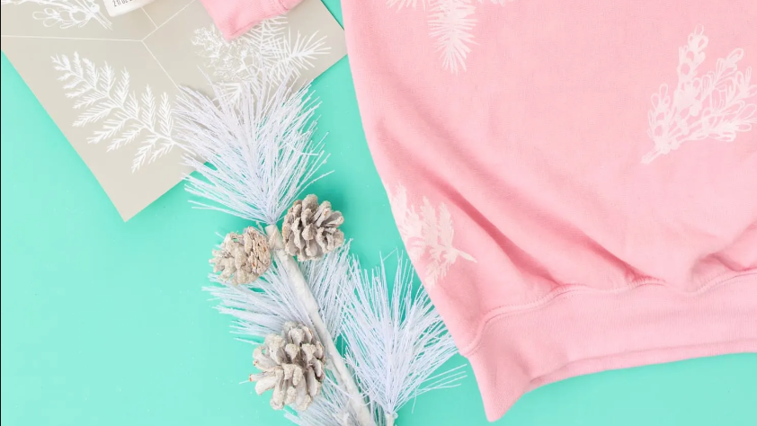 pink evergreen holiday sweaters