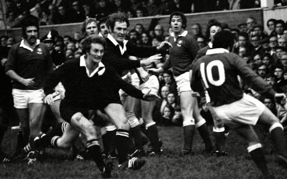 New Zealand half-back Lin Colling and flanker and captain Ian Kirkpatrick bear down on Phil Bennett in the match in 1972  - SHUTTERSTOCK