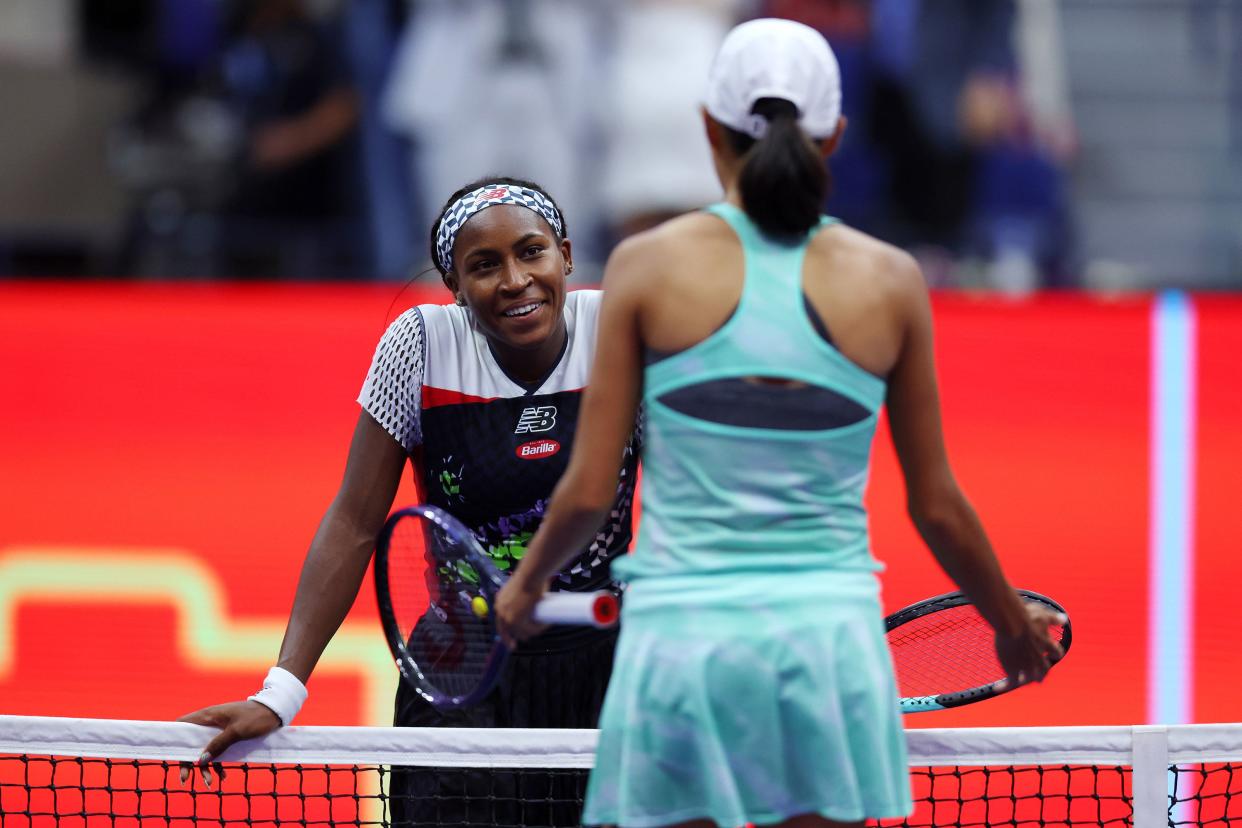 Coco Gauff of the United States hugs Shuai Zhang of China following Gauff's win during their Women's Singles Fourth Round match on Day Seven of the 2022 U.S. Open at USTA Billie Jean King National Tennis Center on Sept. 4, 2022, in Flushing, Queens.