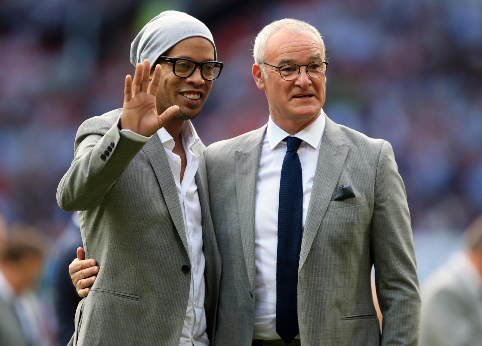 Rest of the World coach Claudio Ranieri (right) and Ronaldinho on the pitch before Soccer Aid 2016 at Old Trafford, Manchester.