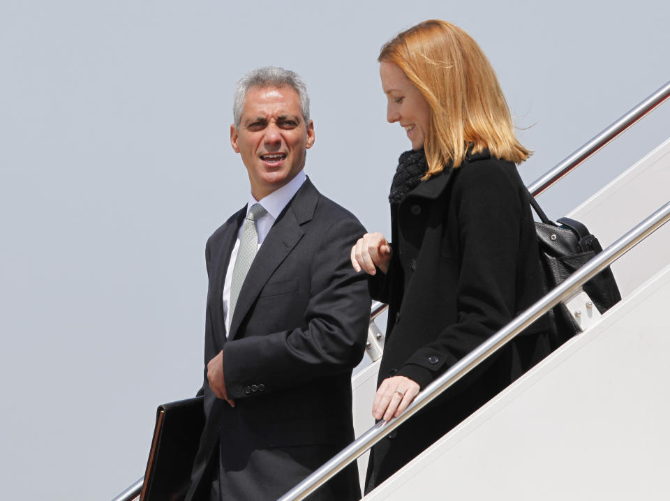 FILE - White House Chief of Staff Rham Emanuel, left, and Deputy White House Communications Director Jen Psaki step off Air Force One as they arrive at Andrews Air Force Base, Md., April 22, 2010. Psaki, whose last day on the job is Friday, has answered reporters' questions nearly every weekday of the almost 500 days that Biden has been in office. That makes her a top White House communicator and perhaps the administration's most public face, behind only the president and Vice President Kamala Harris. (AP Photo/Alex Brandon, File)