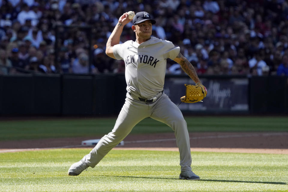 New York Yankees pitcher Jonathan Loaisiga makes the play for an out on a ball hit by Arizona Diamondbacks' Joc Pederson in the ninth inning during a baseball game, Wednesday, April 3, 2024, in Phoenix. Loáisiga said he needs season-ending elbow surgery and will be sidelined for 10-to-12 months. The29-year-old right-hander, said he felt a pop in his elbow while throwing a changeup to Jorge Barrosa, his final batter in the ninth inning of Wednesday's 6-5, 11-inning win at Arizona. (AP Photo/Rick Scuteri)