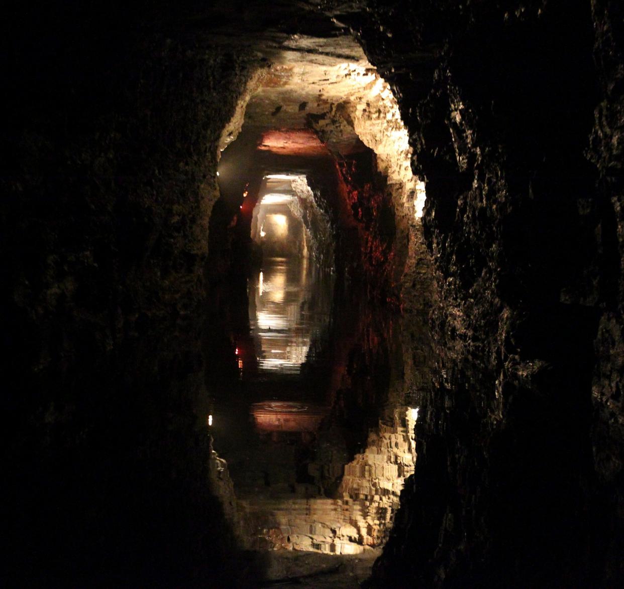 Water reflects the rock of the man-made Lockport Caves in Lockport, N.Y., on Aug. 21, 2014 (2014, BUFFALO NEWS)