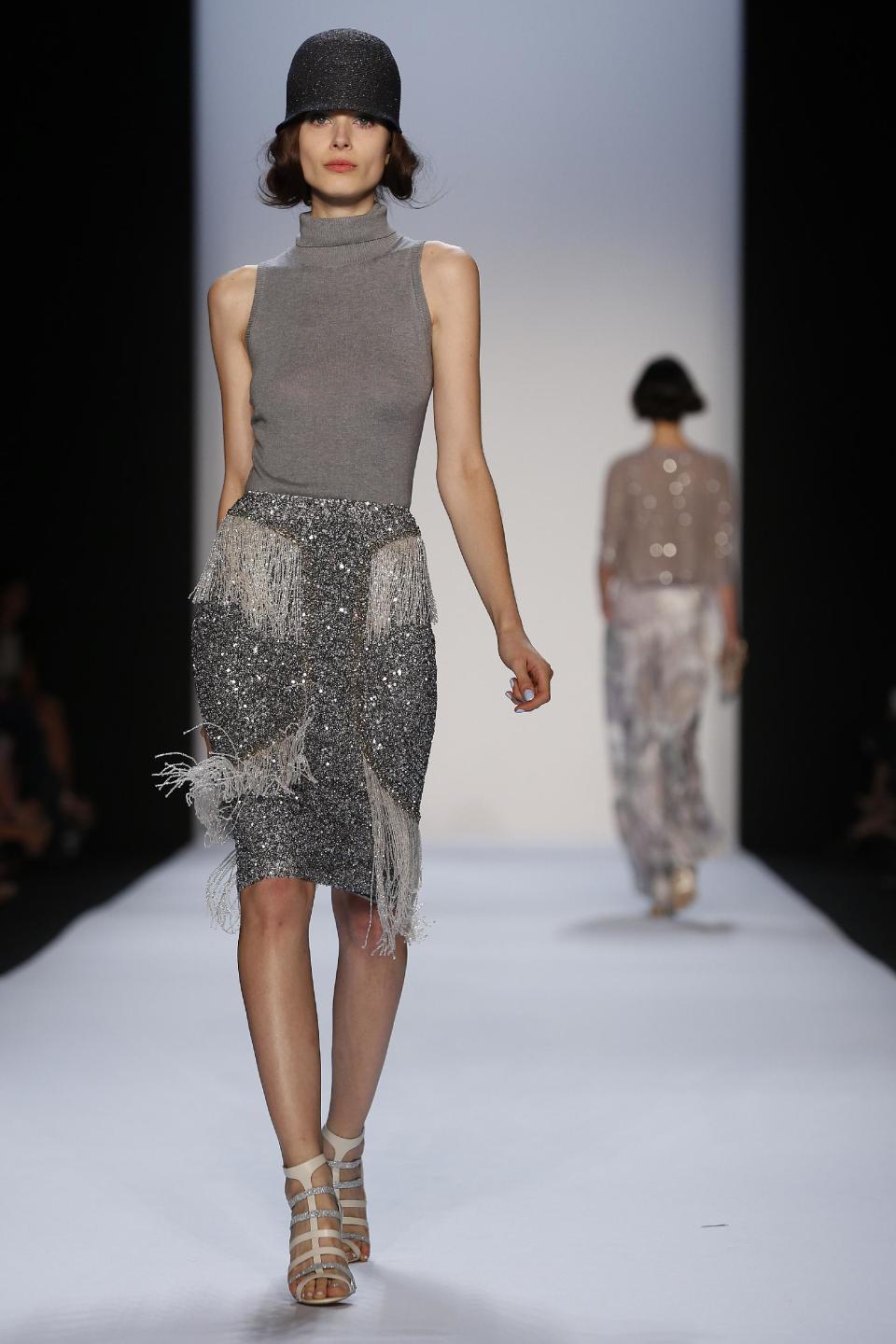 The Badgley Mischka Spring 2014 collection is modeled during Fashion Week in New York, Tuesday, Sept. 10, 2013. (AP Photo/John Minchillo)