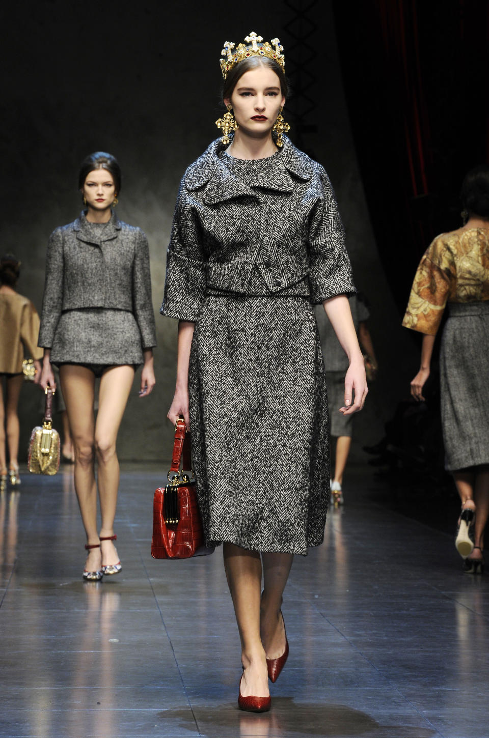 Models wear creations for Dolce & Gabbana women's Fall-Winter 2013-14 collection, part of the Milan Fashion Week, unveiled in Milan, Italy, Sunday, Feb. 24, 2013. (AP Photo/Giuseppe Aresu)