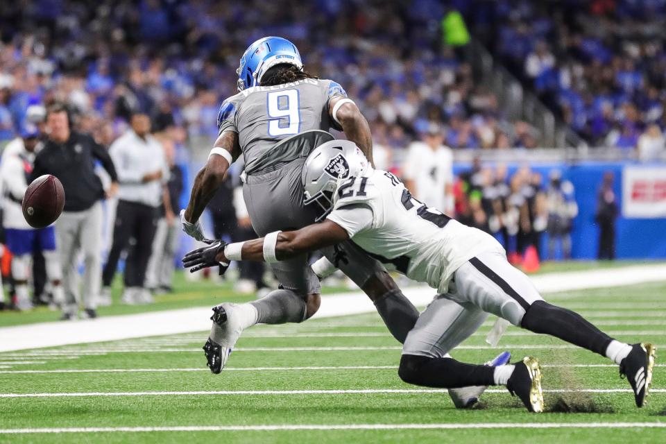 Lions wide receiver Jameson Williams misses a catch against Raiders cornerback Amik Robertson during the first half at Ford Field on Monday, Oct. 30, 2023.