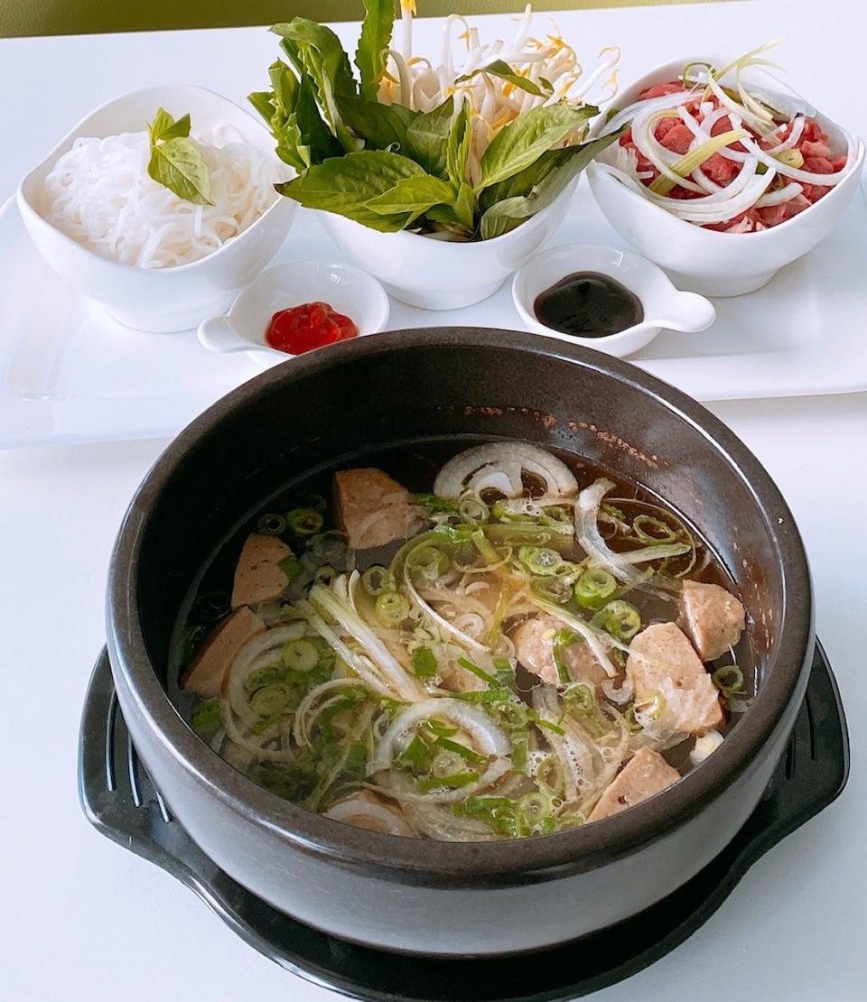 When you order pho at Lychee Bistro, your meal arrives in a specially ordered hot stone bowl from Korea.