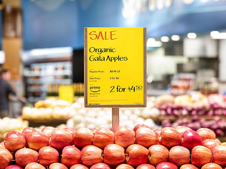 sign displaying that whole foods has a sale on apples