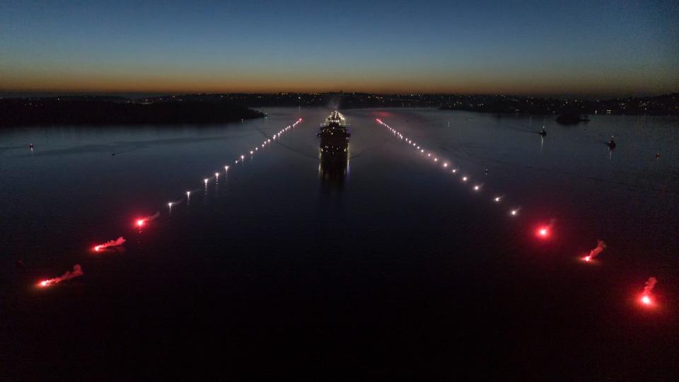 The ship came into the harbour on a ‘runway’ of flares. Photo: Supplied/Princess/James Morgan
