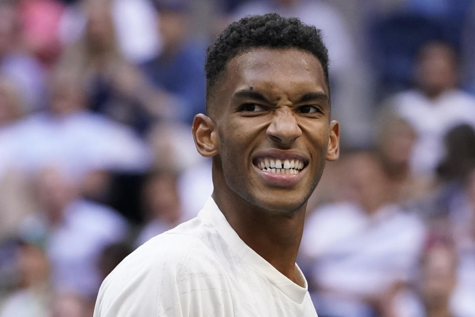 Felix Auger-Aliassime, of Canada, reacts after losing a point to Daniil Medvedev, of Russia, during the semifinals of the US Open tennis championships, Friday, Sept. 10, 2021, in New York. (AP Photo/John Minchillo)