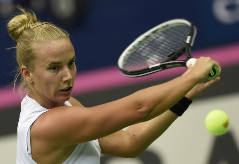 Dutch Richel Hogenkamp returns a ball to Russia's Svetlana Kuznetsova during a Federation Cup tennis world group 1st round match in Moscow on Ferbuary 6, 2016