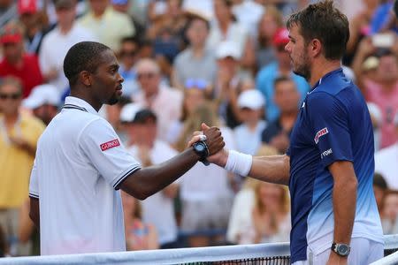 Sep 7, 2015; New York, NY, USA; Stan Wawrinka (right) of Switzerland is congratulated by Donald Young of the United States after defeating him in four sets on day eight of the 2015 U.S. Open tennis tournament at USTA Billie Jean King National Tennis Center. Mandatory Credit: Anthony Gruppuso-USA TODAY Sports